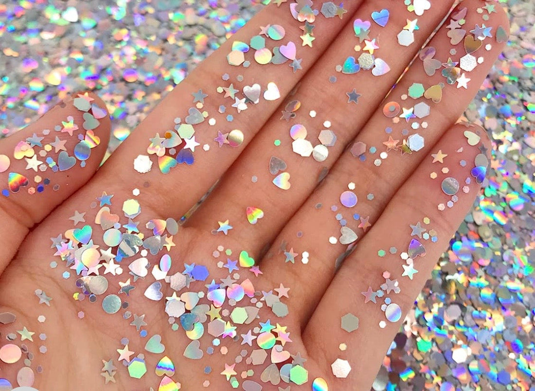 Close-up of cosmetic glitter and face painting supplies, illustrating safe glitter application techniques for face painters
